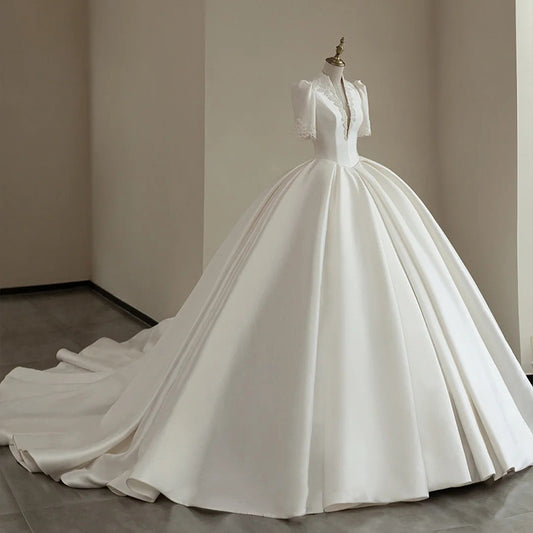 BelaCustom Appliques Plunging V-Neck Half Sleeves Ball Grown Satin Court Wedding Dress